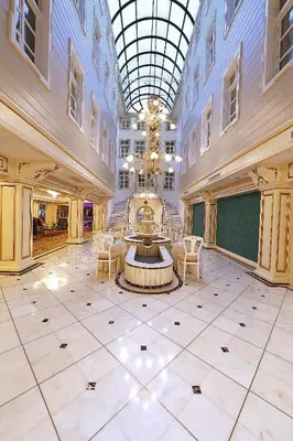 a large lobby with a fountain in the middle of a building at Fuat Pasa Oteli - Special Category Bosphorus in Istanbul