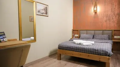 a bedroom with a bed with two towels on it at Second Home Suites in Istanbul