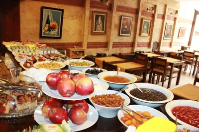 a buffet with many plates of food on a table at Hotel SultanHill in Istanbul