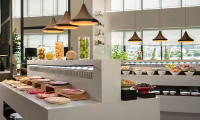 a bakery with many different types of food on display at Centro Westside by Rotana in Istanbul