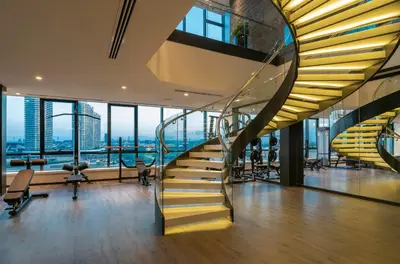 a spiral staircase in a building with a view at Centro Westside by Rotana in Istanbul