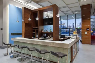 a bar in a building with a view of the city at Hampton By Hilton Bursa in Bursa