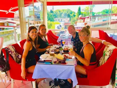 a group of people sitting at a table in a restaurant at Charm Hotel in Istanbul