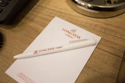 a toothbrush sitting on a piece of paper on a table at Long Stay İstanbul Residence in Istanbul