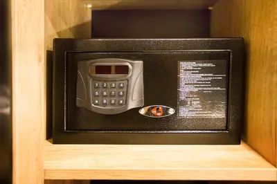 a microwave with a phone inside of a cabinet at Long Stay İstanbul Residence in Istanbul