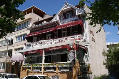a building with red awnings on the side of it at Yeşilköy Airport Hotel in Istanbul