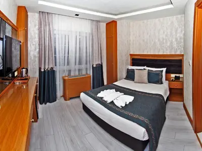a hotel room with a bed with towels on it at Grand Emir Hotel Old City in Istanbul