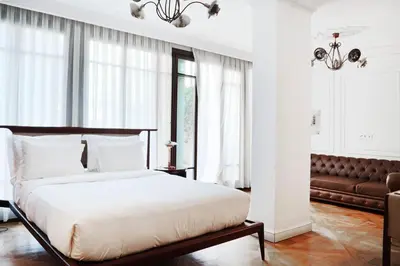 a bedroom with a bed and a couch at Georges Hotel Galata in Istanbul