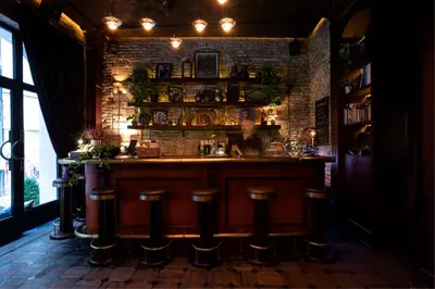a bar with stools in a room with a brick wall at Georges Hotel Galata in Istanbul