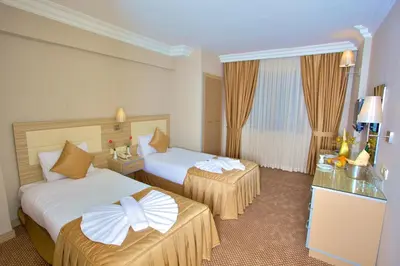 a hotel room with two beds in a room at Laleli Emin Old City Hotel in Istanbul