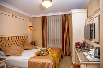 a hotel room with a bed and a television at Balin Hotel - Special Category in Istanbul