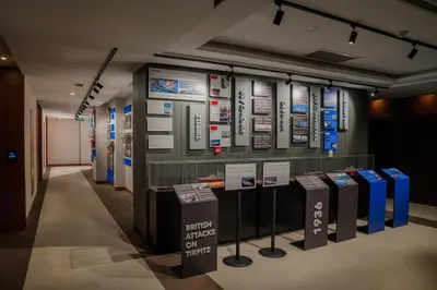 a display case in a museum with signs on the wall at Vespia Hotel in Istanbul