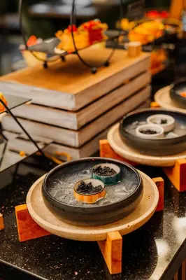 two plates of food on a table with books at Vespia Hotel in Istanbul