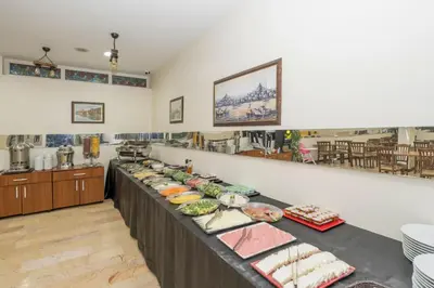 a buffet line with food on it in a room at Tugra Hotel in Istanbul
