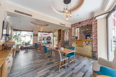 a dining room with tables and chairs in a restaurant at Tayahatun Hotel in Istanbul