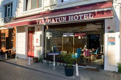 a restaurant with tables and chairs outside of a building at Tayahatun Hotel in Istanbul