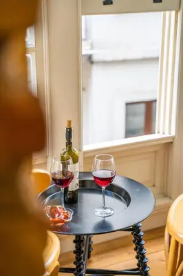 two glasses of red wine on a table with a window at West Pera Hotel in Istanbul