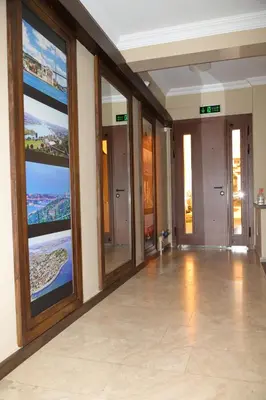 a room with large windows with a view of the ocean at Ramparts Hotel in Istanbul