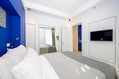 a bedroom with a large bed and a tv at Juno Hotel Taksim in Istanbul