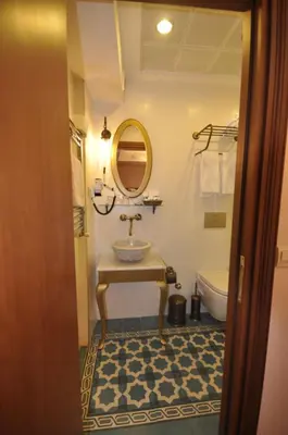 a bathroom with a sink and a mirror at Merial Hotel Sultanahmet in Istanbul