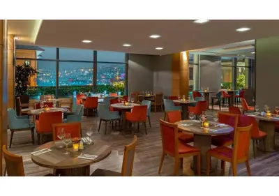 a restaurant with tables and chairs with a view at Dosso Dossi Hotels & SPA Golden Horn in Istanbul