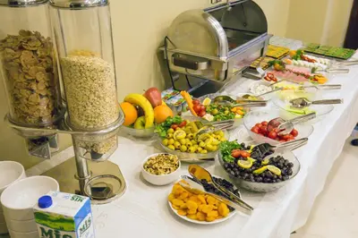 a buffet with many plates of food on a table at Artika Hotel in Istanbul