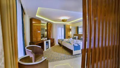 a hotel room with a bed and a bathroom at Beethoven Premium Hotel in Istanbul