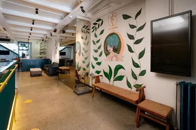 a waiting room with benches and a tv on the wall at Faros Hotel Taksim-Special Category in Istanbul