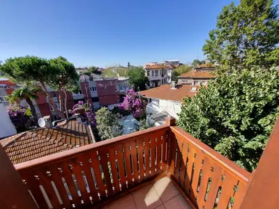 a balcony with a view of a city at Eskibağ Butik Hotel in Buyukada
