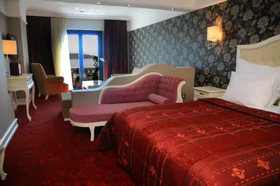 a hotel room with a bed and a couch at Paradise Island Hotel in Gebze