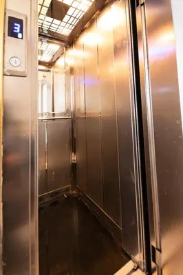 an empty elevator in a building with its door open at Paris Garden Hotel Istanbul in Istanbul