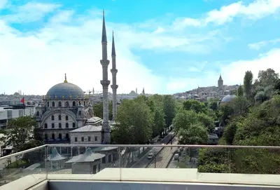 a view of a mosque from a balcony of a building at Port Bosphorus Hotel in Istanbul