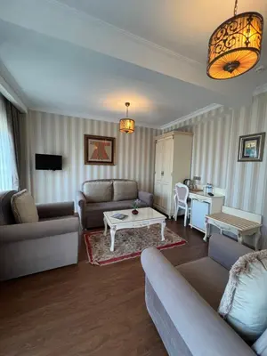 a living room with couches and a coffee table at Muyan Suites in Istanbul