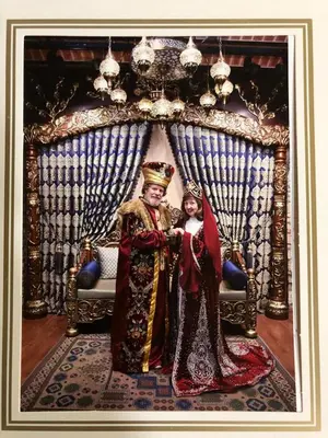 a man and a woman standing in front of a bed at Happy Suite Boutique Hotel in Istanbul