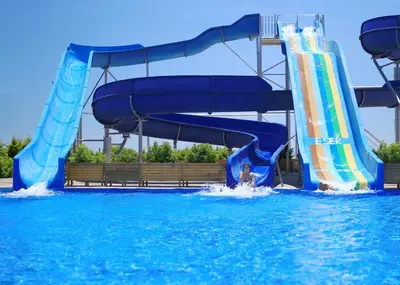 a person riding a water slide in a water park at Eser Diamond Hotel Spa & Convention Center İstanbul in Silivri