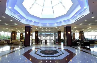 a lobby with a skylight in the middle of a building at Eser Diamond Hotel Spa & Convention Center İstanbul in Silivri