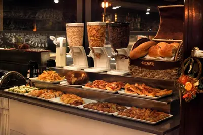 a buffet with many different types of food on display at Hotel Ephesus Istanbul in Istanbul
