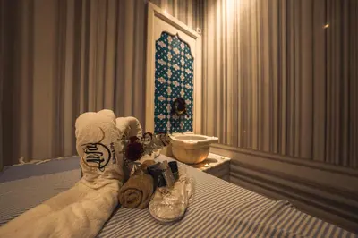 a bedroom with a bed with shoes on it at Alfa Suites & SPA in Sapanca