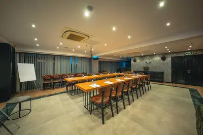 a large conference room with a long table and chairs at Alfa Suites & SPA in Sapanca
