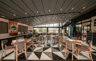 a restaurant with a dining room with tables and chairs at Alfa Suites & SPA in Sapanca