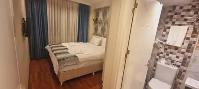 a small bedroom with a bed and a bathroom at By Historial Hotel Due in Istanbul