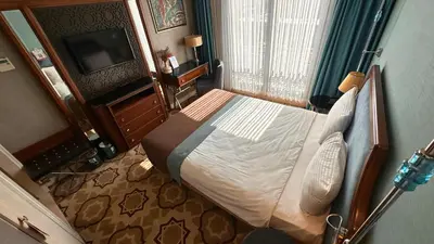a bedroom with a bed and a television in a room at Grand Durmaz Hotel in Istanbul