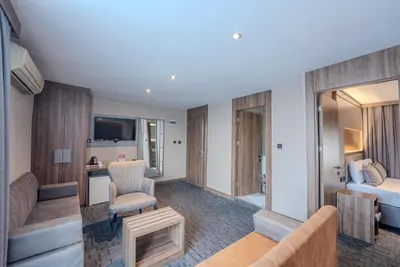 a hotel suite with a living room and a bedroom at Best House Hotel OLD TOWN in Istanbul