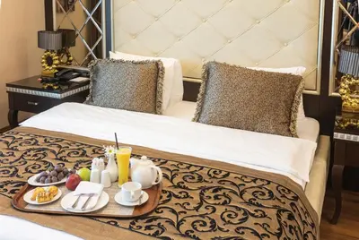 a tray of breakfast foods on a bed at Grand Makel Hotel Topkapi in Istanbul