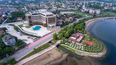 an aerial view of a building next to the water at TRYP by Wyndham Izmit in Kocaeli
