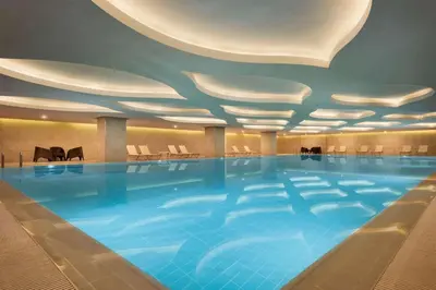 a large swimming pool in a hotel room at TRYP by Wyndham Izmit in Kocaeli