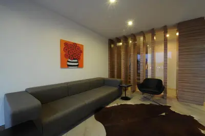 a living room with a couch and a chair at Kardes Hotel in Bursa