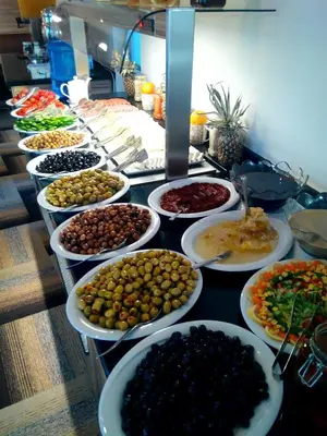 a buffet with many plates of food on a table at Kardes Hotel in Bursa