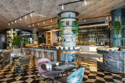 a restaurant with tables and chairs and a bar at Opera Hotel Bosphorus - Preferred Hotels and Resorts in Istanbul