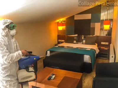 a person in a room with a bed at Collage Pera Hotel in Istanbul